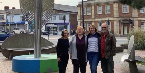 Photo of garden with Radio Solent presenter and 3 garden volunteers