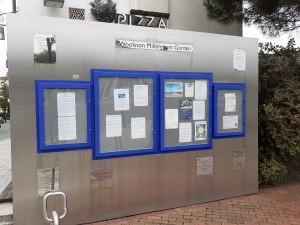 Photo of noticeboard with lovely clear new panes.