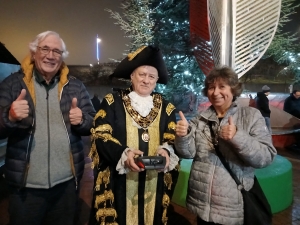 Photo of Mayor of Southampton, Barrie Worth (Chair of Trustees) and Annie Clewlow (Communicare Manager) switching on the lights